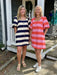 This charming spring dress combines playful style with everyday comfort. Featuring a bold stripe design, it's impossible to miss. The square neckline and puffed sleeves add a sweet, feminine touch, while the button-up front makes getting dressed effortless. Cut as a short dress with a lined interior for a polished fit, it's the perfect piece for creating those Instagram-worthy spring looks. Whether you're heading to brunch or a casual outing, this dress brings instant joy to your wardrobe.

Carolee and Barb