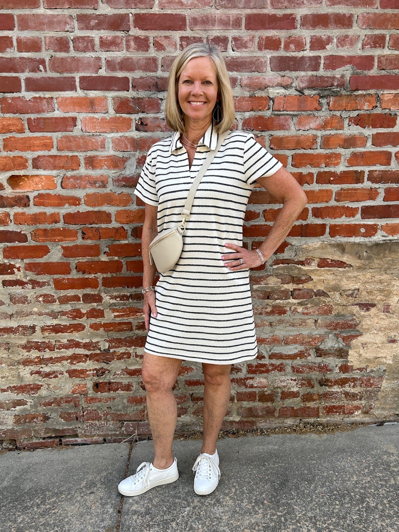 Effortless and versatile, the Allium Striped Dress is your new wardrobe essential. This classic shirt dress features a flattering collared v neckline and timeless striped pattern, crafted from breathable 100% cotton. Perfect for layering or wearing solo, it transitions seamlessly from casual days to relaxed evenings. A go-to piece that works season after season.

Barbara is wearing a size Medium.

Material: 100% Cotton

Care Instructions: Machine wash cold