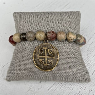 This Beaded Bracelet with an Antique Gold Charm is the perfect accessory for any wardrobe. Its beautiful, subtle beads and unique charm make it an eye-catching addition to any outfit. Plus, it's stretchy and versatile in color, so you can pair it with any ensemble for an effortlessly chic look!