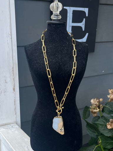 Add a pop of color and elegance to your outfit with our Chunky Paperclip Chain featuring a stunning jasper stone pendant. The charming gold hardware and t-bar closure add a touch of sophistication. Perfect for adding a colorful statement piece to any look.  Designed and made by local artist Approximate measurement: 20"