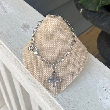 You will love this medium chain linked bracelet with cross pendant! The cross has a hammered look but in a simple square style. You will love this bracelet!  Designed and made by local artist