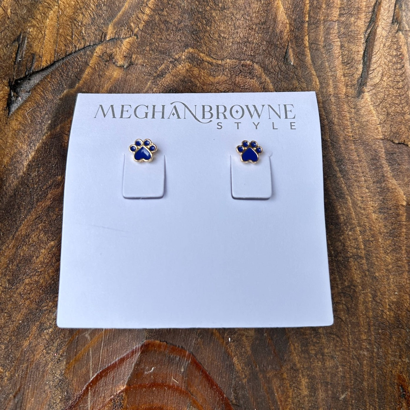Celebrate game day in style with these playful Paw Print Post Earrings. Featuring vibrant colors and a spirited design, they're perfect worn solo or paired together for a bold statement. Lightweight and comfortable for all-day wear, whether you're cheering from the stands or showing your team spirit anywhere.