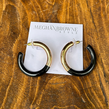 These Black &amp; Gold Hoop Earrings are your go-to accessory for any occasion. Designed with a timeless aesthetic, they work beautifully for evening events, casual outings, and everything in between. The post-back closure provides secure, comfortable wear all day long. With their striking black and gold finish, these hoops add instant polish to your look while remaining a versatile wardrobe essential that pairs with virtually any style. Great for game day too!