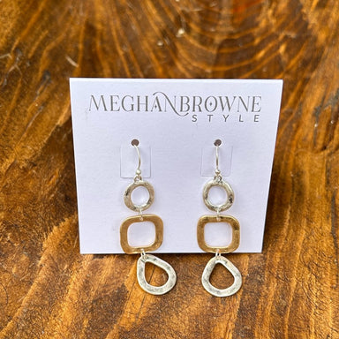 Discover the perfect balance of style and versatility with these Mixed Metal Hammered Dangle Earrings. Crafted with a beautiful blend of gold and silver, the hand-hammered texture creates depth and character that catches light from every angle. The gentle dangle movement adds grace and fluidity to your look, whether you're dressing up for a special occasion or keeping it casual. These earrings seamlessly transition between any outfit, making them an indispensable addition to your jewelry collection for thos