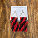 These Red &amp; Black Beaded Dangle Earrings are your go-to accessory. Crafted with precision beadwork, the bold red and black palette brings instant sophistication to game day looks, casual outings, or dressed-up evenings. Lightweight yet impactful, they deliver all the style without sacrificing comfort. Perfect for anyone seeking jewelry that balances statement-making design with practical, all-day wearability.