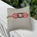 Show your team pride with this eye-catching stretch bracelet. Crafted with gleaming gold beads and accented by vibrant red and black oval links, it's the ultimate game day accessory that transitions seamlessly from the stadium to everyday wear. Comfortable, stylish, and designed to make a statement.