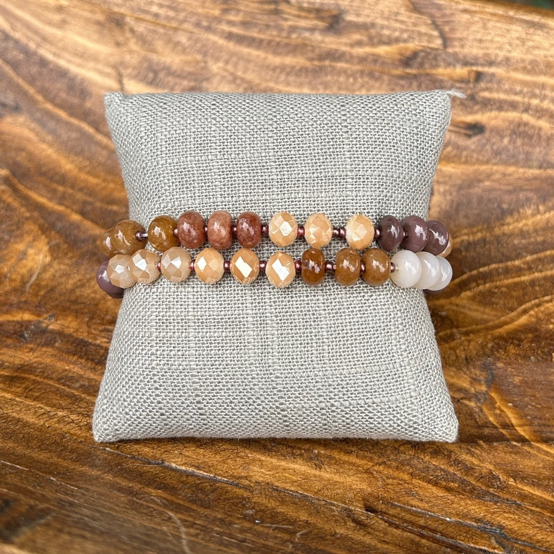 Discover effortless style with this beaded stretch bracelet set in warm earth tones. Crafted in beautiful shades of brown and beige, these bracelets offer endless styling possibilities—wear them solo for understated elegance or layer multiple pieces for a curated, bohemian aesthetic. The stretchy design provides a comfortable, secure fit that works for any wrist size. Perfect for everyday wear or special occasions, this versatile set complements any outfit and pairs beautifully with other jewelry pieces.

P