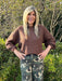 Luxurious dark brown sweater crafted with an interesting textured weave and finished with a stunning satin tie bow accent at the back. The perfect staple for fall and winter layering—wear it solo for a polished look or pair it with your favorite pieces. Versatile enough for every occasion, this sweater combines comfort with contemporary style.

Material: 100% Acrylic

Care Instructions: Gentle wash cold, flat dry