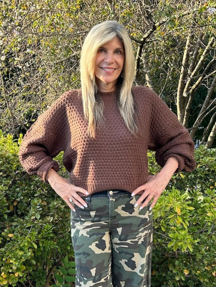 Luxurious dark brown sweater crafted with an interesting textured weave and finished with a stunning satin tie bow accent at the back. The perfect staple for fall and winter layering—wear it solo for a polished look or pair it with your favorite pieces. Versatile enough for every occasion, this sweater combines comfort with contemporary style.

Material: 100% Acrylic

Care Instructions: Gentle wash cold, flat dry
