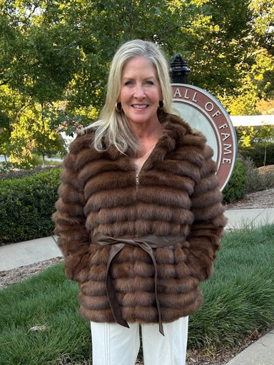 Luxurious faux fur hooded zip-up coat in a gorgeous deep brown. Features a playful oversized hoodie and faux leather tie belt that cinches at the front or back for versatile styling. The perfect layer for transitional weather—dress it up over a skirt or wear it casual with jeans. Premium craftsmanship meets effortless wearability.