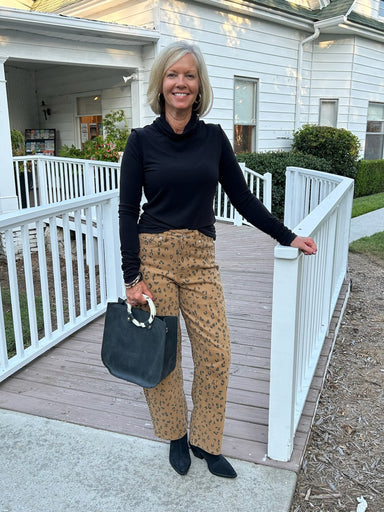 Striking leopard print meets timeless silhouette in these high-waist pants. The wide-leg cut flatters the figure while maintaining effortless style. Pair with a black top and boots for an instantly polished look, or dress them down with a casual tee. Versatile enough for any occasion.