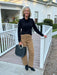 Striking leopard print meets timeless silhouette in these high-waist pants. The wide-leg cut flatters the figure while maintaining effortless style. Pair with a black top and boots for an instantly polished look, or dress them down with a casual tee. Versatile enough for any occasion.