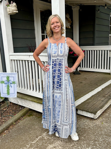 Versatile and breezy, this blue and white patterned midi dress transitions seamlessly from seaside escapes to casual gatherings. The fitted spaghetti straps and lined construction ensure comfort and confidence, while the strategic hem split allows unrestricted movement. Soft, flowing fabric in captivating shades of blue against a clean white canvas creates a look that's both sophisticated and effortlessly wearable for any warm-weather occasion.

Pair with your favorite white or denim jacket!

Barbara is wea