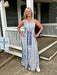 Versatile and breezy, this blue and white patterned midi dress transitions seamlessly from seaside escapes to casual gatherings. The fitted spaghetti straps and lined construction ensure comfort and confidence, while the strategic hem split allows unrestricted movement. Soft, flowing fabric in captivating shades of blue against a clean white canvas creates a look that's both sophisticated and effortlessly wearable for any warm-weather occasion.

Pair with your favorite white or denim jacket!

Barbara is wea