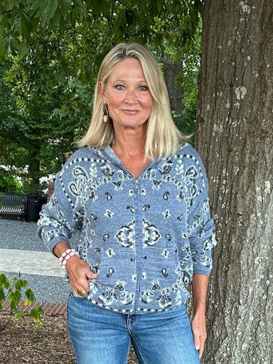Wrap yourself in cozy comfort with this fuzzy knit hoodie cardigan, featuring a charming Nordic blue print that elevates your everyday style. The lightweight zip-up design makes layering effortless, while the soft, textured fabric offers the perfect balance between a classic hoodie and a sophisticated cardigan. Ideal for casual days when you want something fun yet put-together.