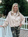 Crafted from sumptuous suede, this zip-up jacket combines timeless elegance with modern comfort. The warm beige hue works seamlessly with any outfit, while the front zip and subtle placket offer practical style. A pleated hem creates visual interest and movement, complemented by thoughtfully placed stitching and distinctive shoulder details. The soft, luxurious feel makes it ideal for layering or wearing as a statement piece. A versatile essential that transitions effortlessly from day to night.