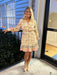 You will love this Border Print Shirt Dress. Crafted on a soft cream foundation, the eye-catching multi-color border print adds visual interest without overwhelming the silhouette. The structured button-front design pairs beautifully with a flattering V-neckline, while long sleeves provide coverage and elegance. An elastic and belted waist defines your shape and offers adjustable comfort throughout the day. Fully lined for a refined finish, this short dress works beautifully dressed up with heels or kept ca