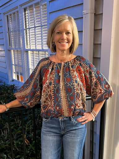 Your will love this flattering puffed sleeve floral top. The relaxed, easy-fit silhouette pairs beautifully with denim or trousers, while the elbow-length sleeves and elastic waist create a flattering, comfortable look perfect for transitioning between seasons. Rich fall tones bring warmth to any outfit.