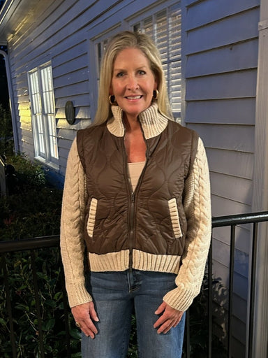 Sporty zip-up jacket in brown with cream trim detailing. Perfect for casual wear with distinctive mixed-media styling that sets it apart from everyday basics.