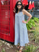 Tara wearing a navy and white pinstripe sleeeless linen maxi dress. It has a fabulous collar and v-neckline. 
