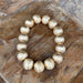 This Large Gold Beaded Stretch Bracelet adds a touch of glamour to any outfit! Its lustrous gold color and larger beads make it perfect for any holiday occasion!
