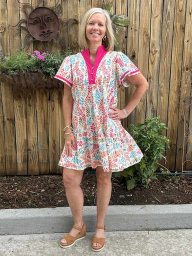 This is the perfect throw on and go dress for summer when you need to look put together but don't want to think about what to wear! We love the bright colors in the leaf print, the hot pint V-neck, and the flattering fit. It's a great length, too. The fabric is light weight and is lined, but not hot.&nbsp;


Barbara is wearing a small.&nbsp;

Material: 100% Cotton; Lining: 100% Polyester

Care Instructions: Hand wash cold, hang to dry