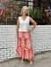 This long skirt by THML is so comfortable and flattering. We love the summer color and pretty pattern in the lightweight, flowy fabric. The elastic waste is comfortable and not so gathered that it looks full. Of course, we love that is has pockets!&nbsp;

Barbara is wearing a small and paired it with our V-neck knit top in white (also a small) and her espadrilles.&nbsp;

Material: 55%&nbsp;

Care Instructions: Hand wash cold inside out, line dry