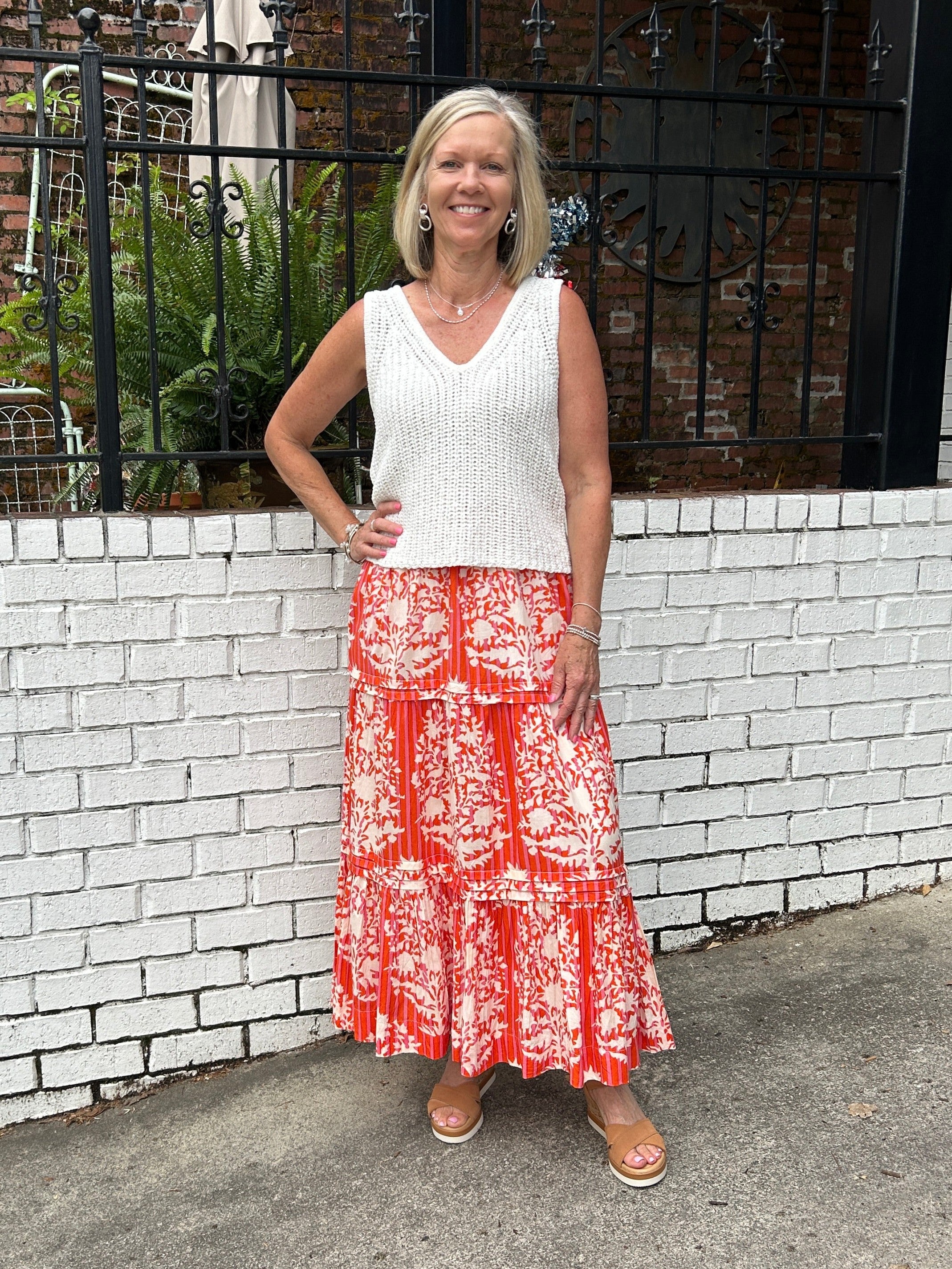 This long skirt by THML is so comfortable and flattering. We love the summer color and pretty pattern in the lightweight, flowy fabric. The elastic waste is comfortable and not so gathered that it looks full. Of course, we love that is has pockets!&nbsp;

Barbara is wearing a small and paired it with our V-neck knit top in white (also a small) and her espadrilles.&nbsp;

Material: 55%&nbsp;

Care Instructions: Hand wash cold inside out, line dry