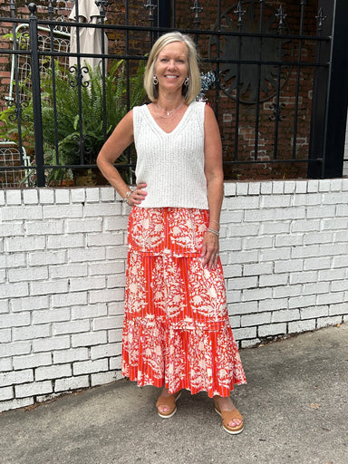 This long skirt by THML is so comfortable and flattering. We love the summer color and pretty pattern in the lightweight, flowy fabric. The elastic waste is comfortable and not so gathered that it looks full. Of course, we love that is has pockets!&nbsp;

Barbara is wearing a small and paired it with our V-neck knit top in white (also a small) and her espadrilles.&nbsp;

Material: 55%&nbsp;

Care Instructions: Hand wash cold inside out, line dry