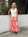 This long skirt by THML is so comfortable and flattering. We love the summer color and pretty pattern in the lightweight, flowy fabric. The elastic waste is comfortable and not so gathered that it looks full. Of course, we love that is has pockets!&nbsp;

Barbara is wearing a small and paired it with our V-neck knit top in white (also a small) and her espadrilles.&nbsp;

Material: 55%&nbsp;

Care Instructions: Hand wash cold inside out, line dry