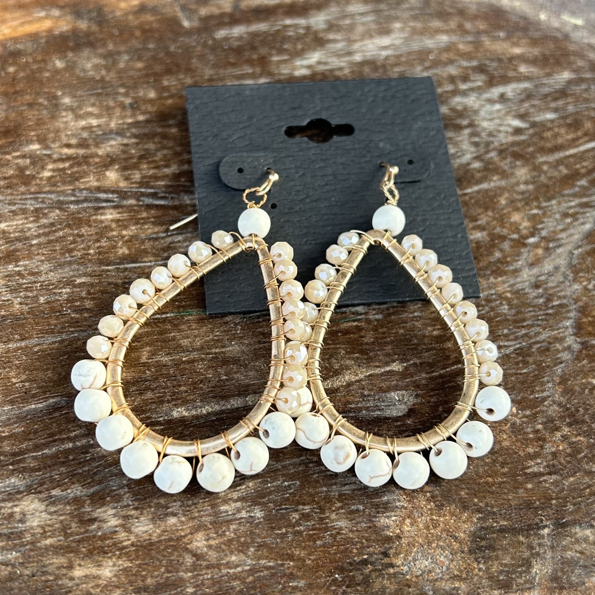 Introducing our lovely Teardrop Beaded Earrings! Trimmed in gold and featuring a teardrop shape covered in beads and sparkling crystals, these earrings will add a touch of luxury to any outfit. With multiple color options, you can easily match them to your ensemble. 