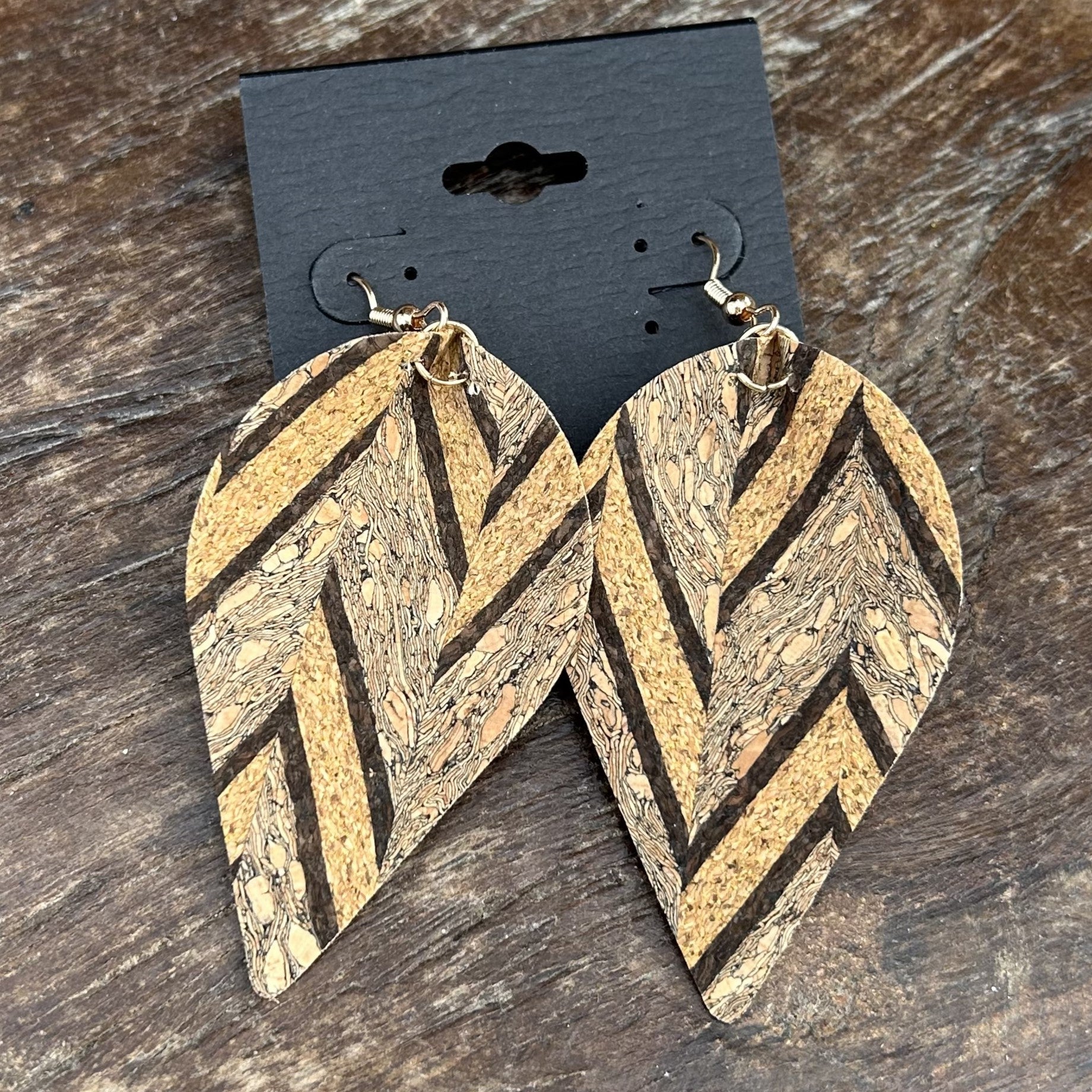 Get ready to love our Geometric Cork Earrings! These lightweight and boho-chic earrings are crafted in a leaf shape, making them fun and unique. Add a touch of creativity to your outfit and stand out with these statement earrings.