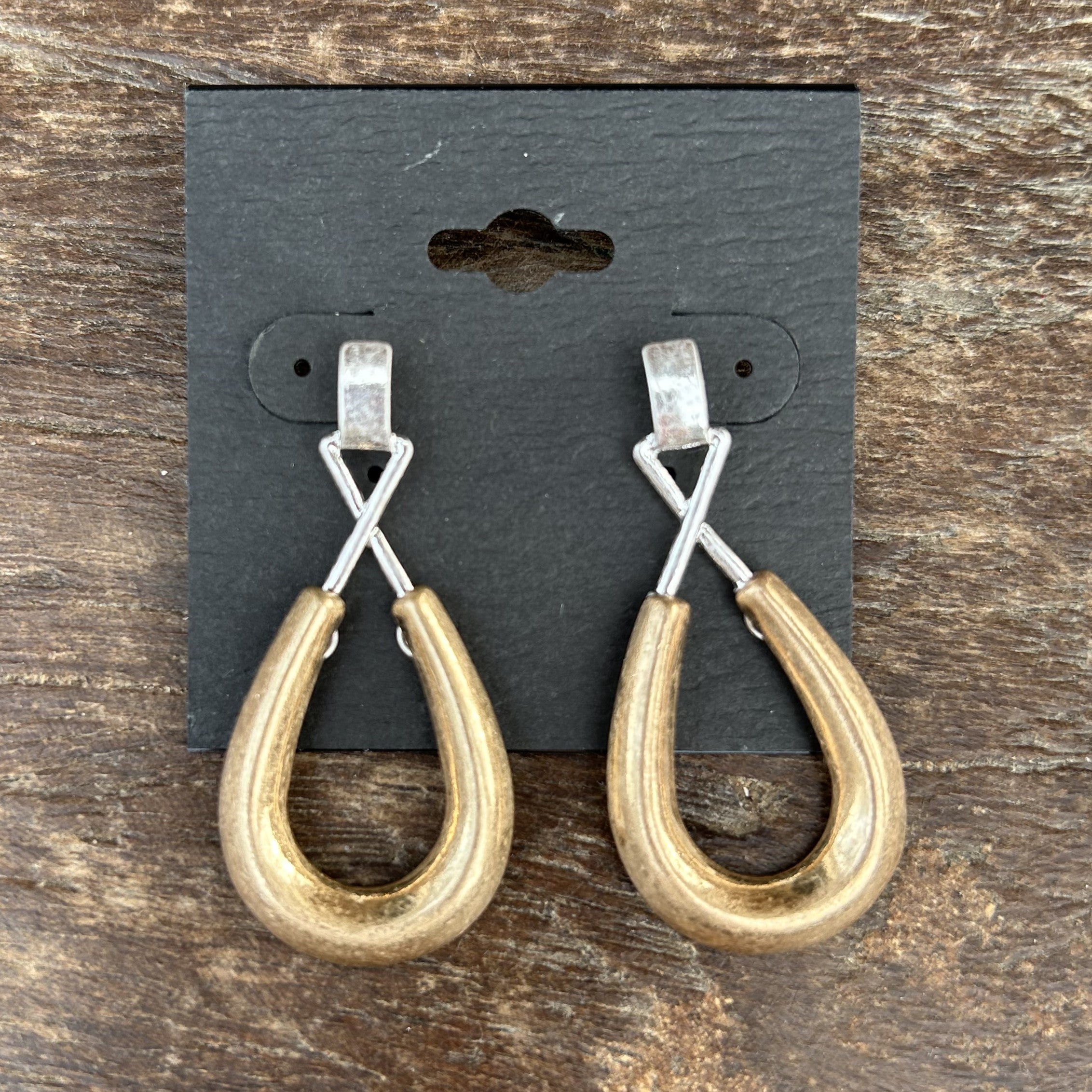 Discover elegance and style with these Two Tone Teardrop Earrings. Featuring a unique and modern design, these earrings are perfect for both formal and casual occasions. The secure post closure ensures comfortable wear all day long. Enhance any outfit with these elegant yet casual earrings.