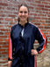 How adorable is this "track suit!" with all of it's fun style! The silky feel of the fabric is so soft and flowy. The shorts with their orange and pink side stripes have an elastic waist with a drawstring are super cute and flattering! The jacket has a full zipper with a ruffle accent and those same bold stripes from the shoulder to the wrist. It's a fabulous set!

Grier is wearing a small in each piece.&nbsp;

Sold as a set.

Material: 100% Polyester

Care Instructions: Gentle cool hand wash, dry flat