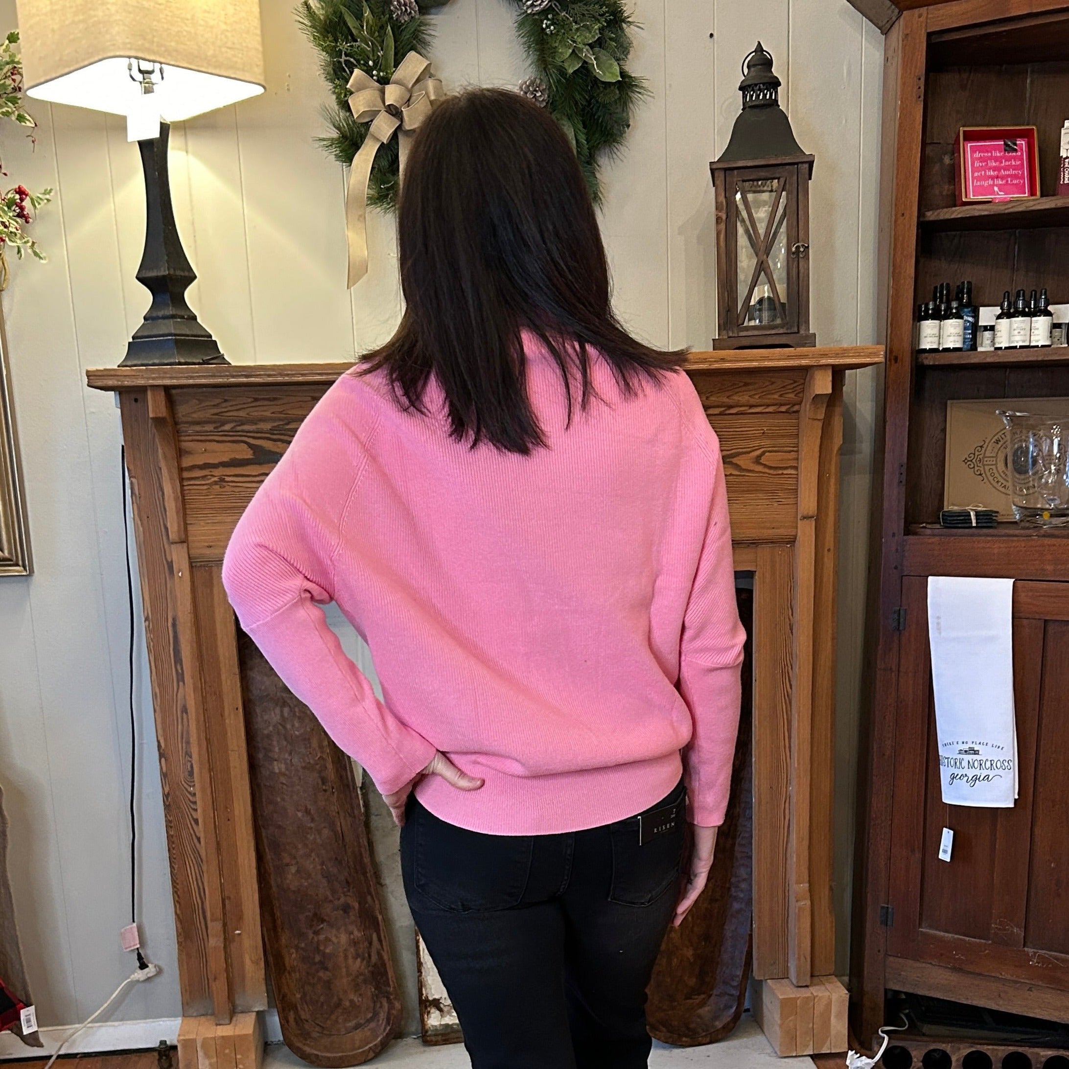 back view of bat wing sweater in bubble gum pink.