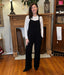Black cord overalls with pockets and adulstable straps.