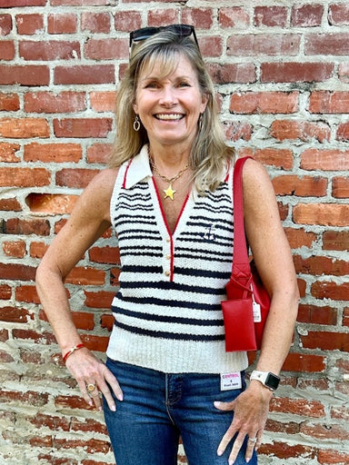 Celebrate in style with this patriotic sleeveless textured top featuring a classic red, white, and blue color palette. The flattering V-neck with collar and charming anchor monogram add nautical flair, while gold button accents elevate the look. Perfect for holiday gatherings and summer outings, it pairs effortlessly with jeans or navy shorts for a polished, patriotic ensemble.

Material: 100% Polyester

Care Instructions: Hand wash cold separately, lay flat to dry