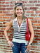 Celebrate in style with this patriotic sleeveless textured top featuring a classic red, white, and blue color palette. The flattering V-neck with collar and charming anchor monogram add nautical flair, while gold button accents elevate the look. Perfect for holiday gatherings and summer outings, it pairs effortlessly with jeans or navy shorts for a polished, patriotic ensemble.

Material: 100% Polyester

Care Instructions: Hand wash cold separately, lay flat to dry
