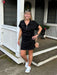 Experience the perfect blend of comfort and functionality with this scuba knit skort. Made from luxuriously soft fabric, it delivers the coverage and ease you need for everything from casual outings to active pursuits. We love the flattering length, the comfortable fit, and the built in short. It pairs perfectly with our quarter zip top for an effortless coordinated look. Your new go-to in classic black.

Carolee is wearing a Small.&nbsp; She paired it with our matching "Scuba Knit Quarter Zip Top".

Materi