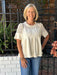 This ivory blouse combines delicate lace applique with soft faux sueded fabric for a versatile piece that transitions seamlessly from casual to dressy occasions. The unique texture pairing and intricate detailing make it a standout addition to any wardrobe.

Barbara is wearing a size Small.

Material: 92% Polyester / 8% Spandex; Contrast: 65% Cotton / 35% Polyester&nbsp;

Care Instructions: Hand wash separately in cold water, hang to dry