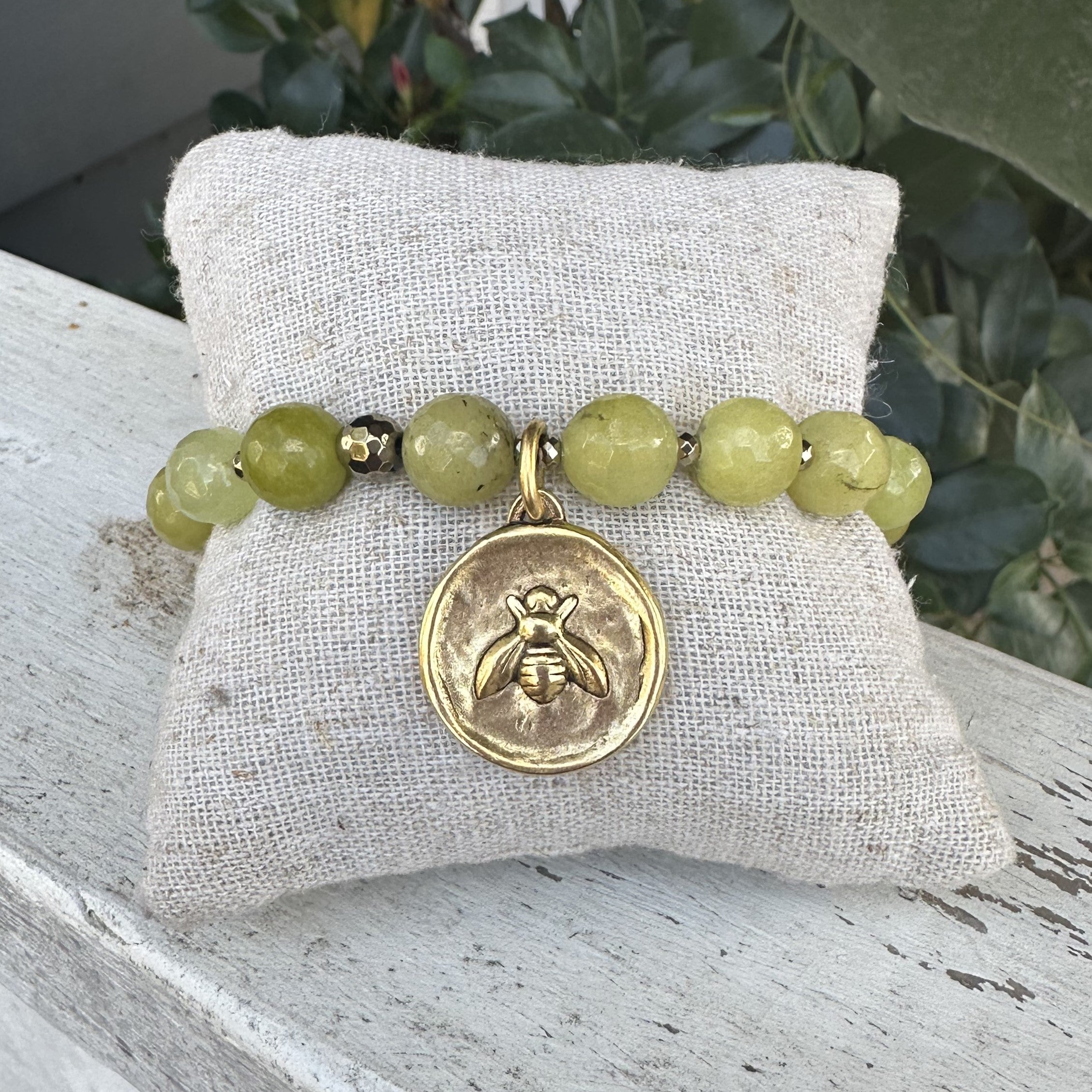 Beaded bracelets are so in! You will love the extra touches of this bracelet. The beads are slightly faceted to catch the light. The charm has a bee on one side and fleur de lis on the other. Such a pretty bracelet!