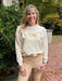 Feel light and stylish in our Relaxed Fit Lightweight Sweater! The cream color and crew neck give a classic touch, while the long sleeves provide warmth. The contrasting front bow adds an elegant touch to any outfit. Stay comfortable and chic all day!

Material: 100% Acrylic; Contrast: 100% Polyester

Care Instructions: Hand wash cold, line dry