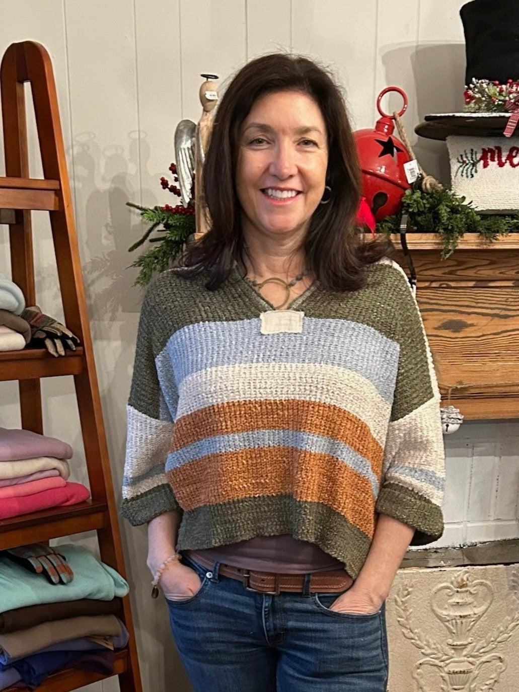 This boho-inspired sweater features a striking striped design in tan, olive, light blue and rust shades. With 3/4 sleeves and a notched collar, it offers a beautiful casual look.

Material: 70% Acrylic / 30% Nylon&nbsp;

Care Instructions: Hand wash cold, line dry