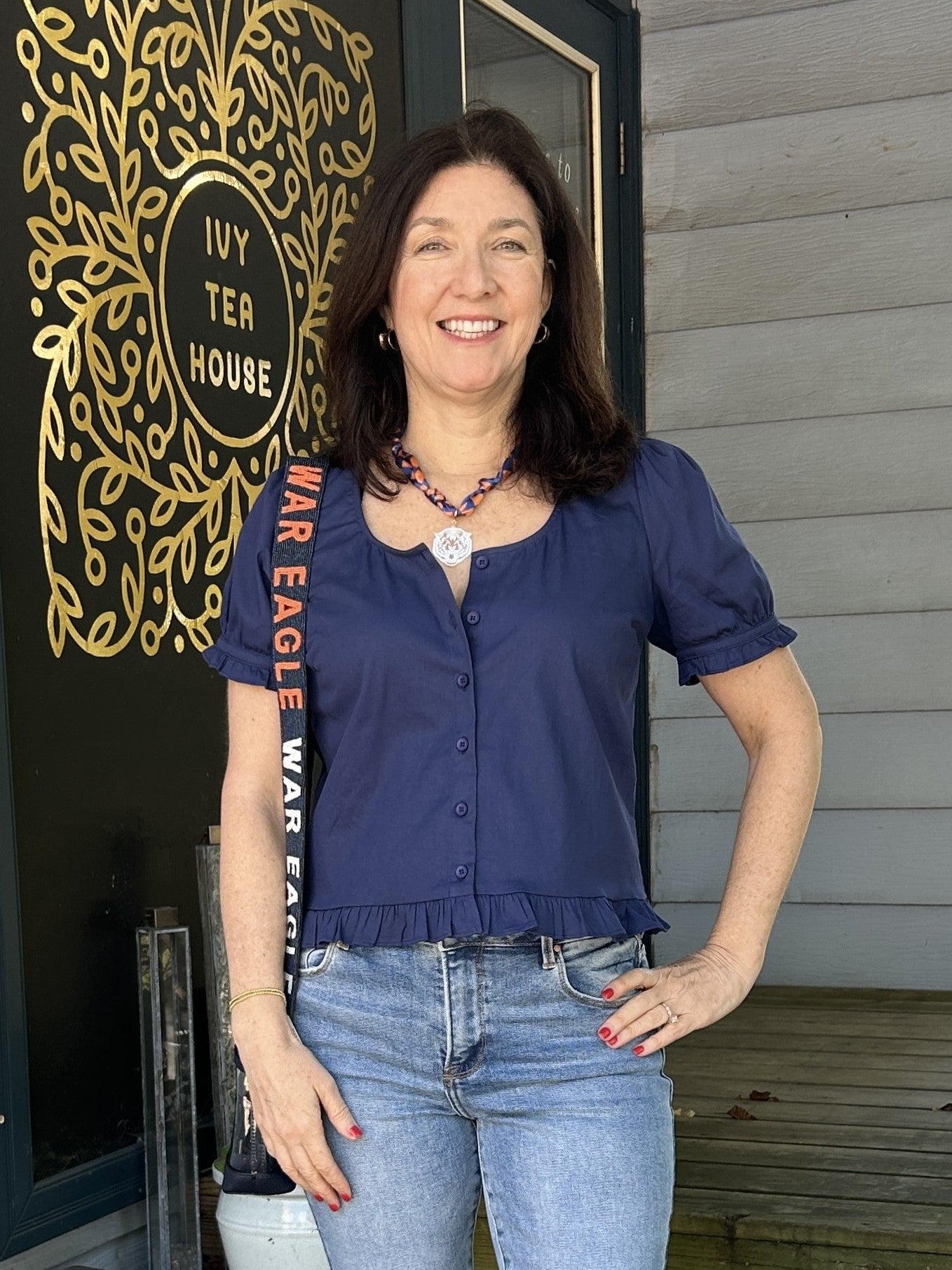 Prepare for game day in style with this Button Up Short Sleeve Top featuring charming ruffle accents. Its lightweight fabric ensures all-day comfort, while the button-up front offers versatile wear as a top or a light jacket. The striking navy color adds a vibrant touch to your look, making it the perfect choice.

Material: 95% Cotton / 5% Spandex

Care Instructions: Hand wash cold, lay flat to dry