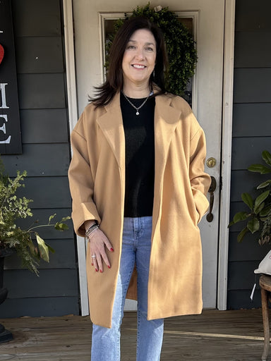 Upgrade your winter wardrobe with our Oversized Long Sleeve Coat. This beautiful camel coat is the perfect staple piece for any cold weather outfit. Its oversized design not only adds an effortless touch to your look, but also provides maximum warmth and comfort.&nbsp;

Material: 100% Polyester

Care Instructions: Hand wash cold, line dry