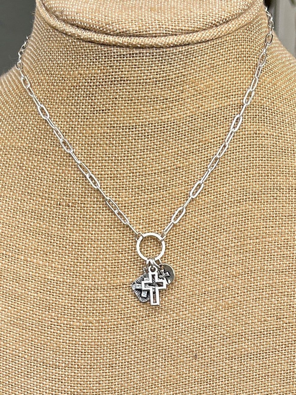 This Elongated Chain Necklace with Triple Cross Drop is perfect for any occasion. Crafted in silver, the necklace features elongated chain links and three unique and different cross drops, spanning between 17-19' in length. Add a hint of sophistication to your style with this special piece.
