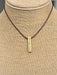 This stylish leather necklace with bar drop is perfect for everyday wear. The 15-17" leather chain is lightweight yet durable, and the bar drop, with 'Strength' etched onto it, adds a casual and inspirational touch. Show off your bold sense of style with this fashionable necklace.