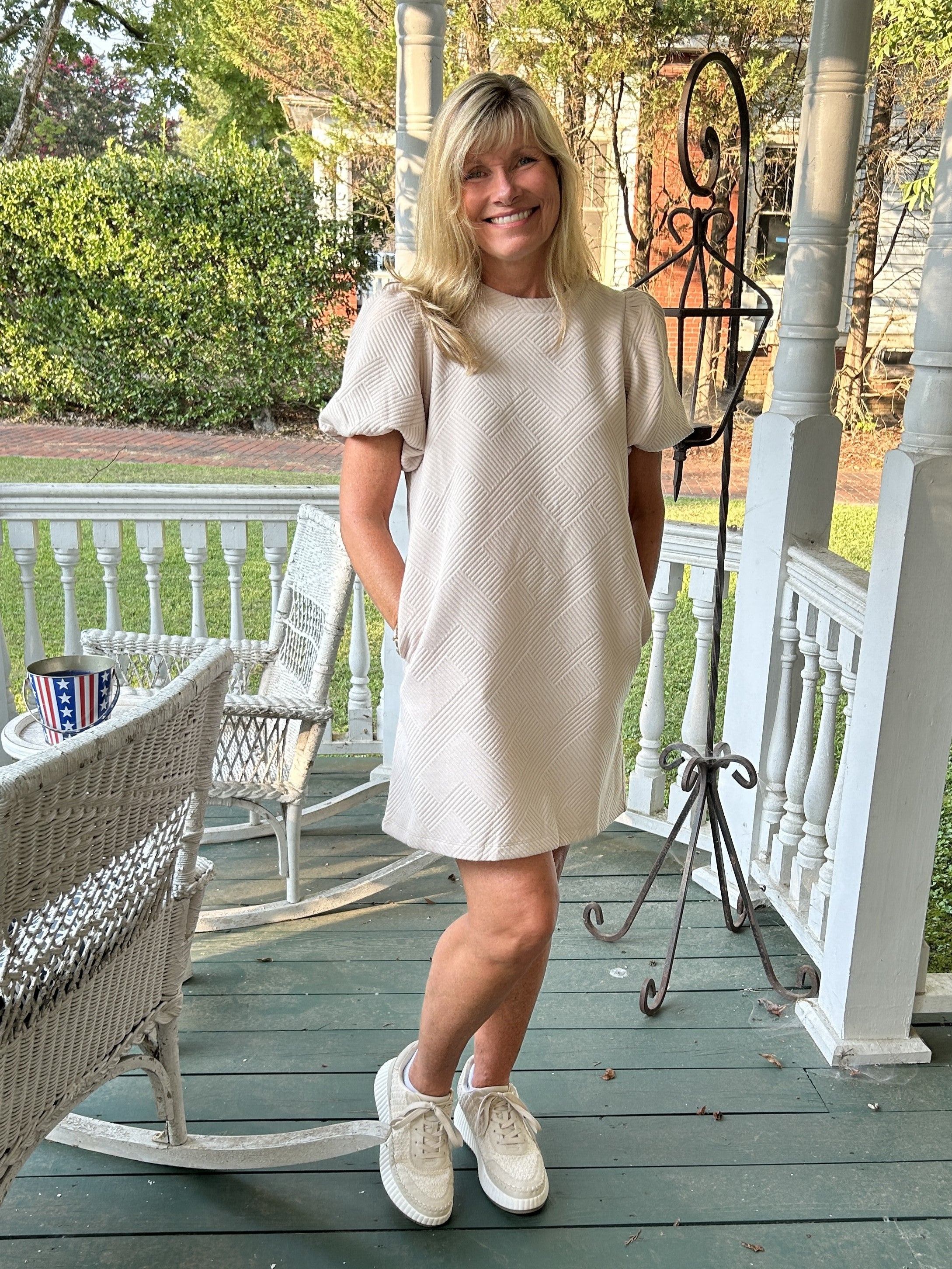 You will love this simple but Textured Puff Sleeve Mini Dress! With its unique geometric design, this top is sure to add a flare to any outfit. The cute puffed sleeve, side slit pockets and lovely sand color make it a versatile staple for any occasion. Dress it up or wear it casual, this dress is a must-have in your wardrobe!  Material: 95% Polyester / 5% Spandex  Care Instructions: Hand wash cold, line dry