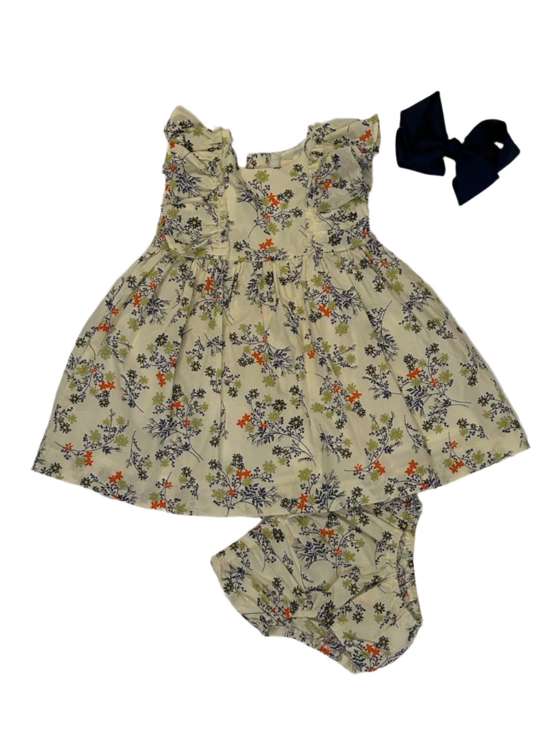 Dress your little one in undeniable charm with this delightful floral baby dress and matching bloomers. The eye-catching print and adorable ruffled sleeves create an irresistible look. Perfect for photos, special events, or just making everyday moments more magical.

Bow not included.