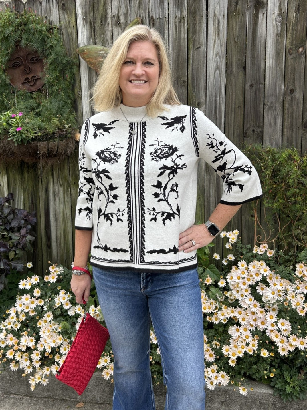 Add dimension to your closet with this modern sweater that proves neutral doesn't mean boring. The warm light beige backdrop showcases an artistic black abstract print that brings contemporary style to classic comfort. Three-quarter sleeves hit at just the right length for layering or wearing solo, while the mock neck creates a sleek, intentional silhouette. Pair it with your go-to jeans for weekend ease or black pants for a more refined appearance—either way, you'll have a piece that feels both timeless an